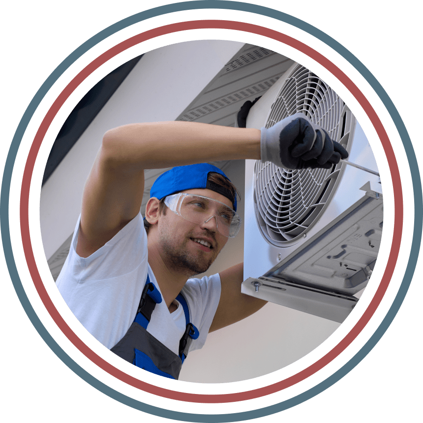 Man repairing an air conditioning unit.